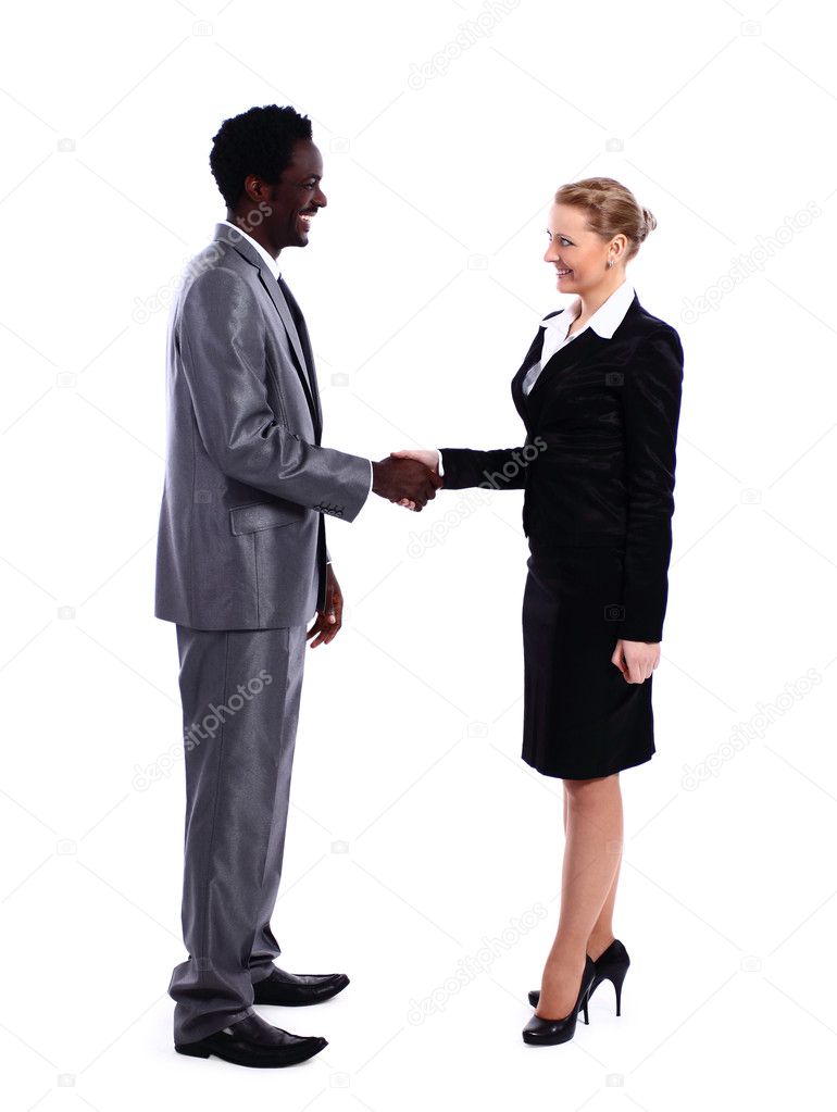 African businessman shaking hands with white business woman