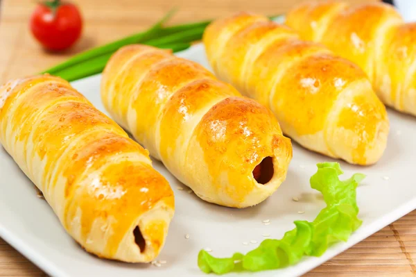 Stock image Sausage in dough