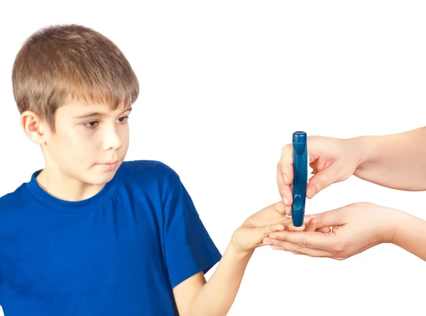 The boy is doing a test for diabetes — Stock Photo, Image