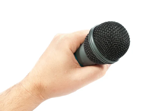 Micrófono en la mano. foto aislada sobre fondo blanco — Foto de Stock