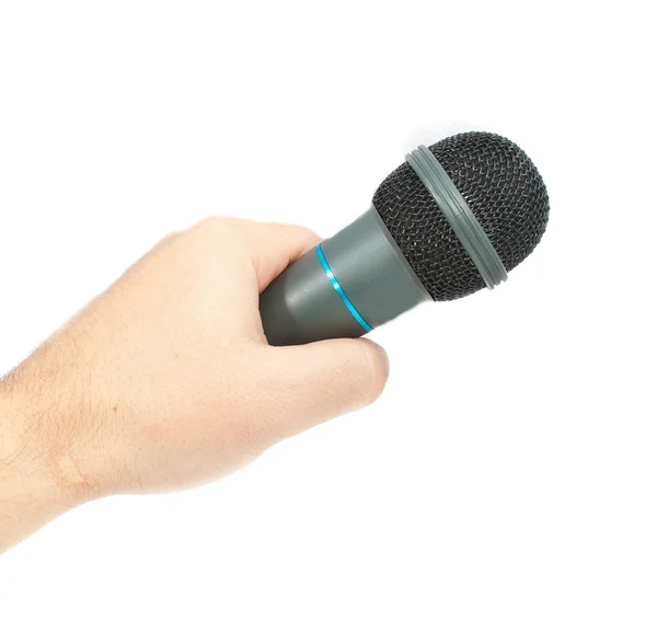 Mikrofon in der Hand. Foto isoliert auf weißem Hintergrund — Stockfoto