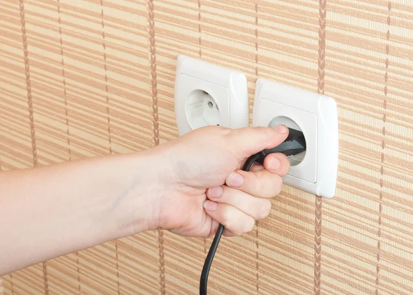 Hand insert the plug into the power — Stock Photo, Image