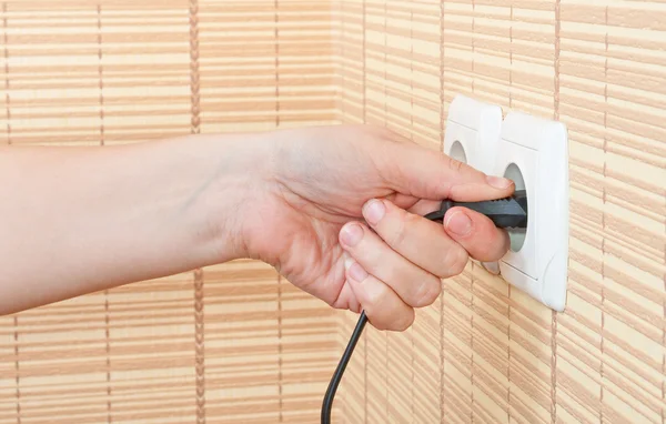Hand insert the plug into the power — Stock Photo, Image