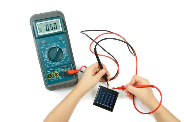 Electronic tester and solar battery — Stock Photo, Image
