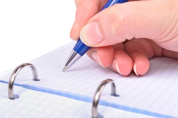 Egy kéz, egy golyóstollal írja a notebook — Stock Fotó