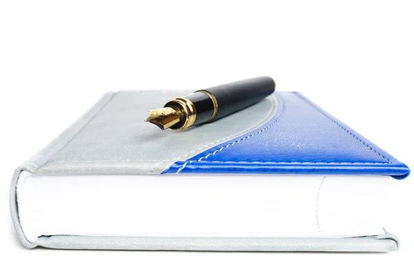 Ink pen and a notebook — Stock Photo, Image