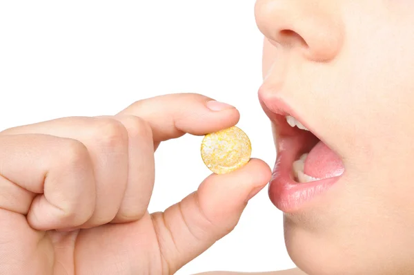 stock image The child puts the pill into his mouth