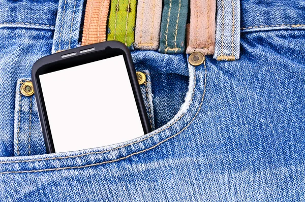 Мобильный телефон в кармане джинсов — стоковое фото