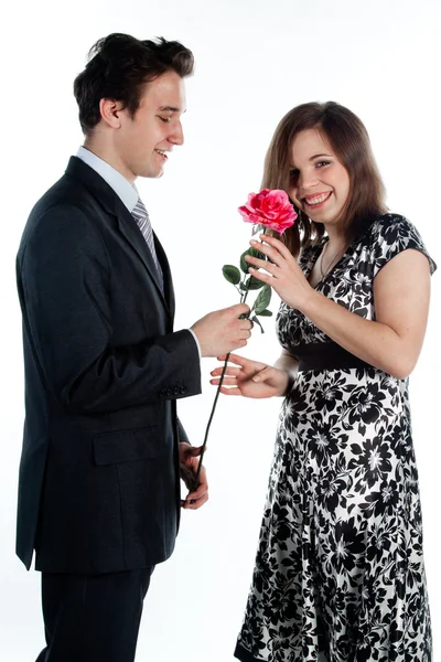 Man gives a woman flowers — Stock Photo, Image