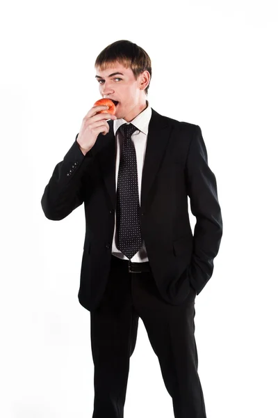 Homem de negócios com uma maçã vermelha — Fotografia de Stock
