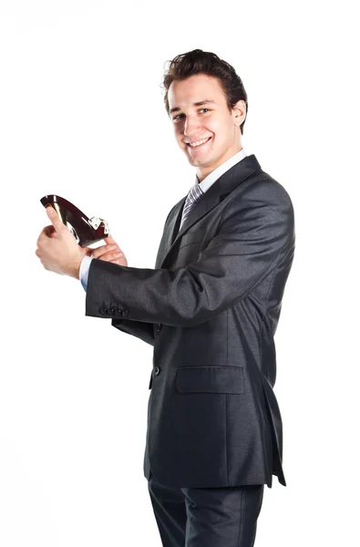 Young businessman with hands in the women's shoes — Stock Photo, Image