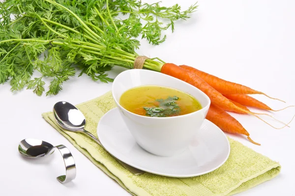 Carrot soup with spring vegetables — Stock Photo, Image