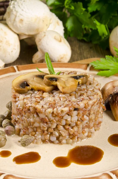 Buckwheats with nut cream and mushrooms — Stock Photo, Image