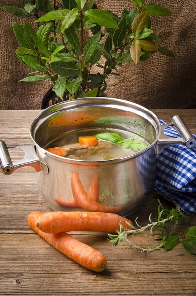 Pot with broth — Stock Photo, Image