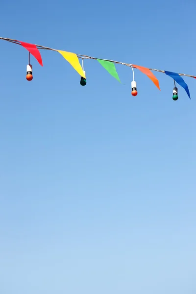 stock image Boxes with colored light bulbs in the spring sky