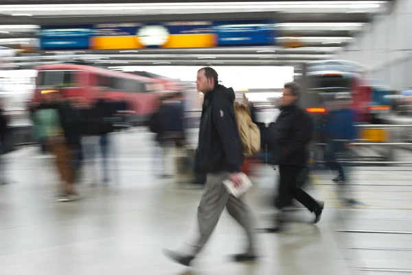 Blurred view of walking on the railway station — Stock Photo, Image