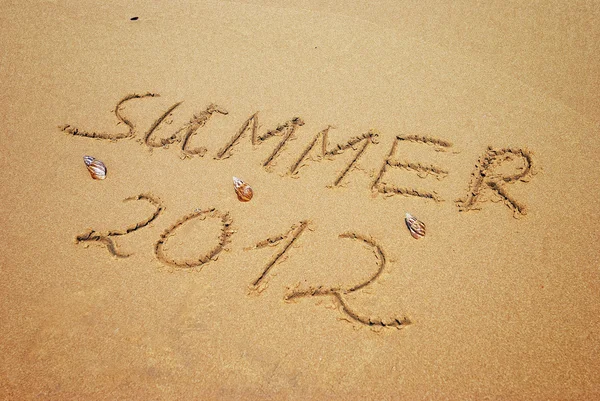 Επιγραφή στην υγρή άμμο καλοκαίρι 2012 — Φωτογραφία Αρχείου