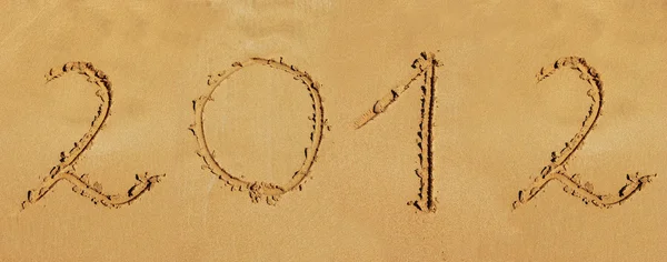 Napis 2012 na piaszczystej plaży — Zdjęcie stockowe