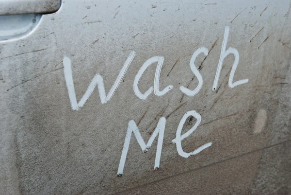 stock image Inscription wash me in the car door