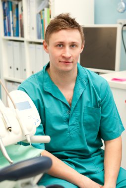 Dentist in his surgery