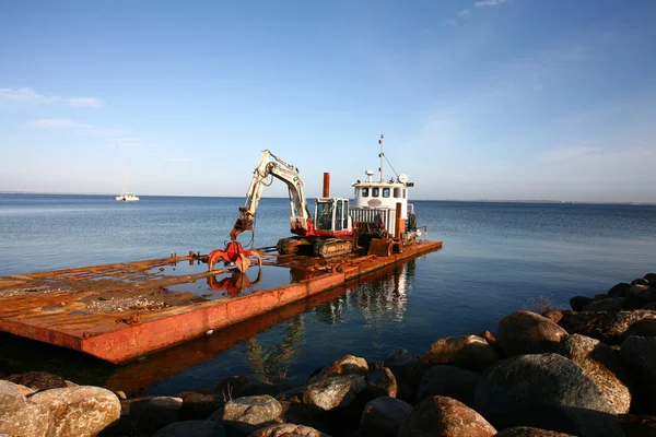 Boat with bulldozer Stock Photo