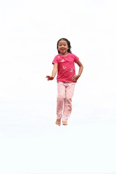 Feliz salto de niño — Foto de Stock