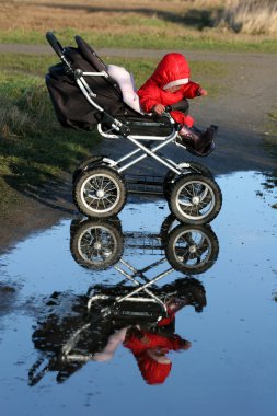 Child in a carriage clipart