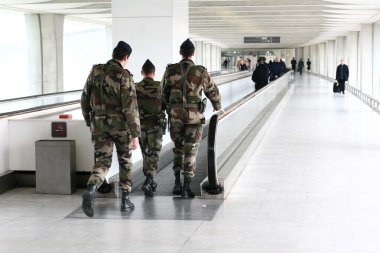 Military at the Paris CDG airport clipart