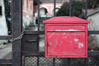 Mailbox in a garden's gate clipart