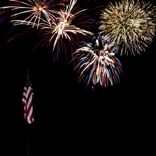 Fuochi d'artificio sulla bandiera americana Foto Stock Royalty Free