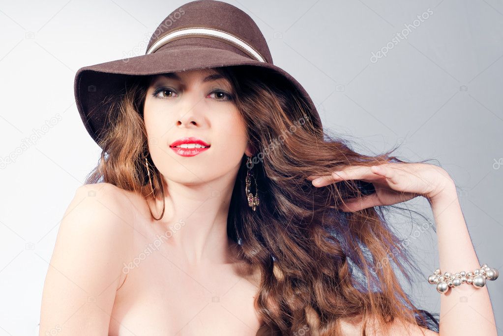 Young beautiful fashion woman wearing hat