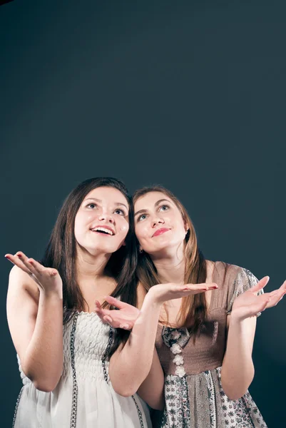 Two happy women catching copy space — Stock Photo, Image