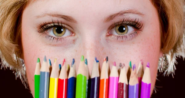 Beautiful young girl with colorful pencils — Stock Photo, Image