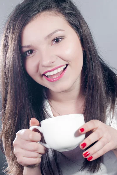Beautiful young girl with a cup — Stock Photo, Image