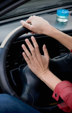 Hands on steering wheel clipart