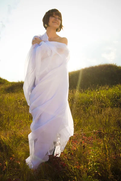 Happy woman in white fabrics — Stock Photo, Image