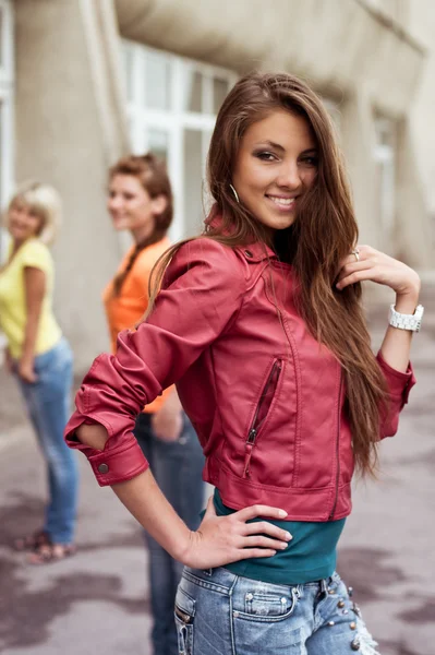 Happy longhaired girl with friends — Stock Photo, Image