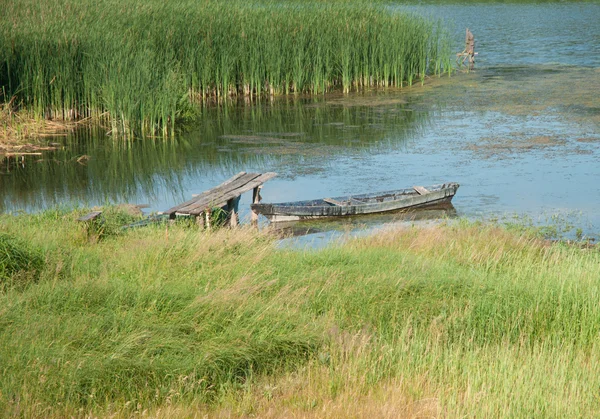 stock image Old wood boat on river