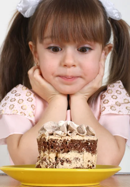 Child girl and cake
