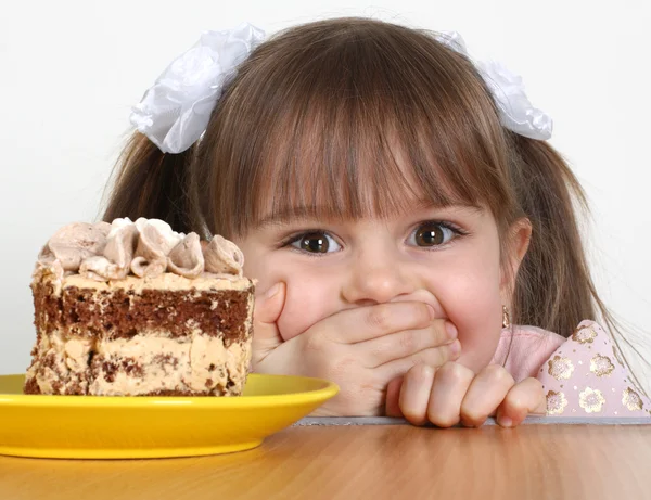 Kind meisje met cake Stockfoto