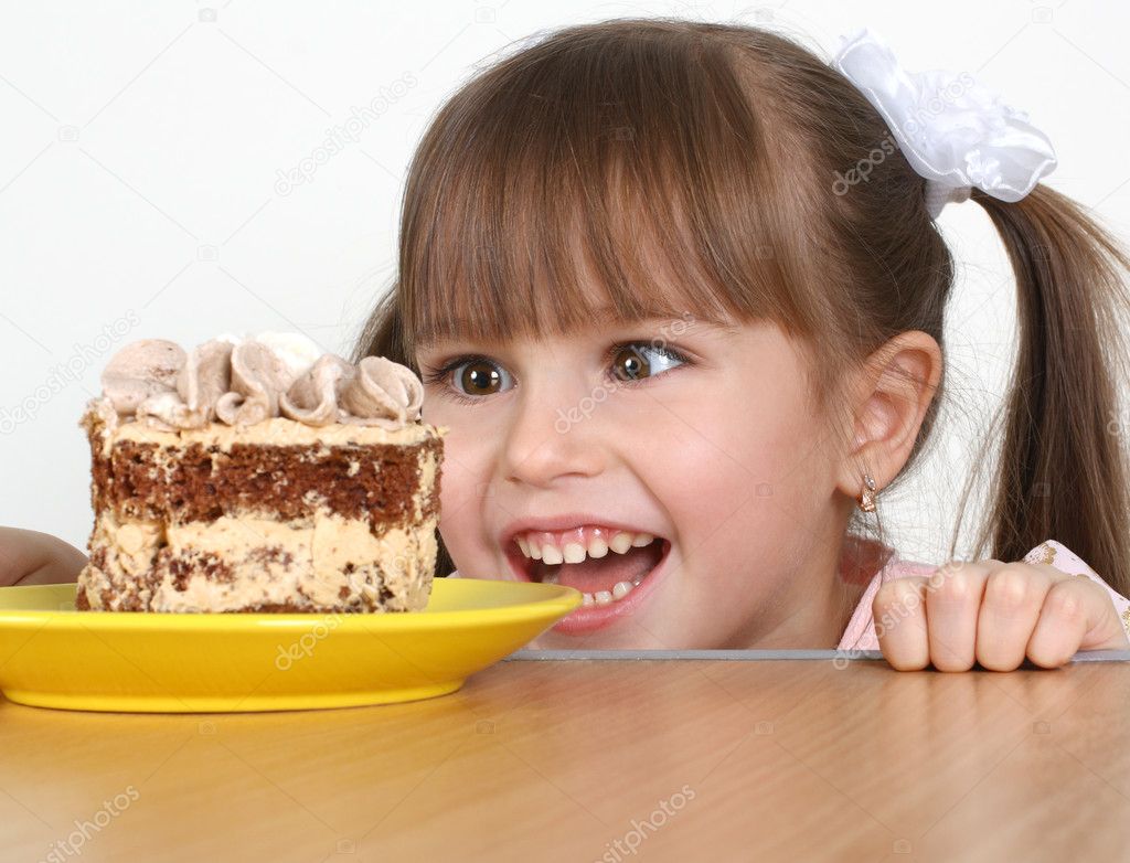 Child girl with cake