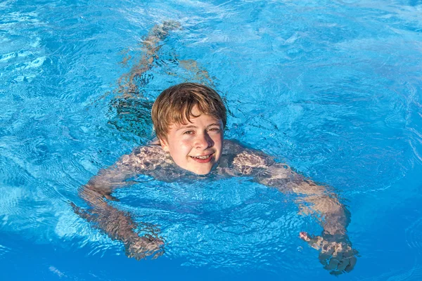 stock image Boy swimming in the pool