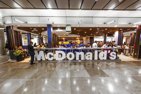 stock image Customers having their meals at McDonalds at Madrid airport
