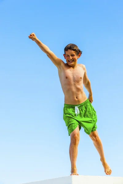 Cute boy posing on a roof — Stock Photo, Image