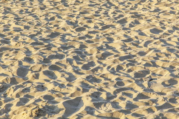 Marques de pieds à la plage de sable fin — Photo