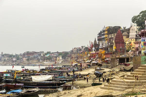 Colorful main ghat in varanasi with boats — Stock Photo, Image