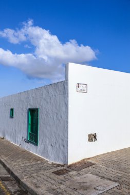 Facade f mediterranean house with closed shutterblinds