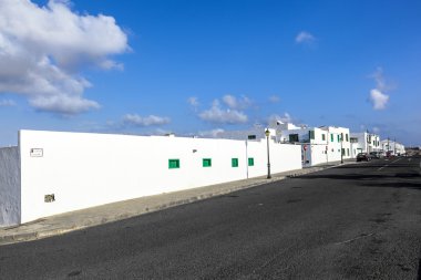 Facade f mediterranean house with closed shutterblinds