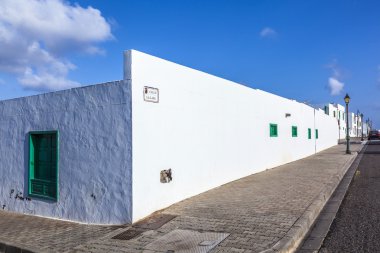 Facade f mediterranean house with closed shutterblinds