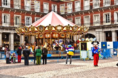 Carousel for children at Madrids Plaza de major in Christmas tim clipart